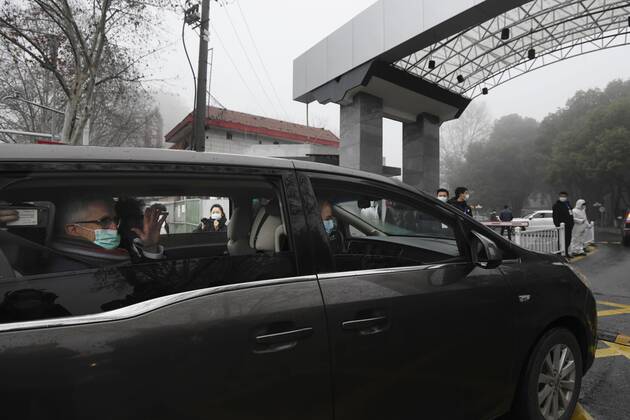 WHO probe into coronavirus origins in Wuhan A vehicle carrying members of the World Health Organization s team investigating the origins of the coronavirus pandemic enters an infectious disease prevention center in Wuhan, China, on Feb. 1, 2021. 