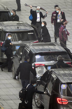 WHO probe into coronavirus origins in Wuhan Members of the World Health Organization s team investigating the origins of the coronavirus pandemic arrive at an infectious disease prevention center in Wuhan, China, on Feb. 1, 2021. 