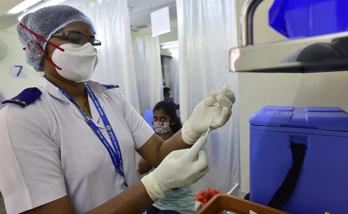 MUMBAI, INDIA - FEBRUARY 1: A BMC health worker prepares a dose of Covid-19 vaccine during a vaccination drive at Nair Hospital, on February 1, 2021 in Mumbai, India. (Photo by Anshuman Poyrekar Hindustan Times) India s Covid-19 Vaccination Drive