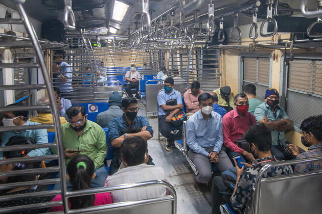 MUMBAI, INDIA - FEBRUARY 1: Travellers in a suburban local train on the first day when local train services starts for general public, on February 1, 2021 in Mumbai, India. Travel by local trains, lifeline for millions of people living in Mumbai and surrounding satellite towns, was severely restricted after the coronavirus outbreak in March 2020. (Photo by Pratik Chorge Hindustan Times) Mumbai Local Trains Resume Services For General Public