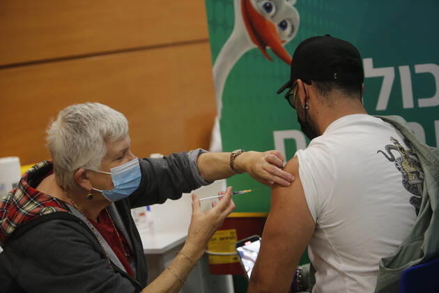 (210201) -- TEL AVIV, Feb. 1, 2021 -- A man receives the COVID-19 vaccine at a health service center in Tel Aviv, Israel, on Feb. 1, 2021. Israel s Ministry of Health reported 8,399 new COVID-19 cases on Monday, bringing the tally in the country to 651,405. The number of people vaccinated against the COVID-19 in Israel has surpassed 3.14 million, or 33.8 percent of its total population, since the vaccination campaign began on Dec. 20, 2020. (Photo by Xinhua) ISRAEL-TEL AVIV-COVID-19-VACCINATION GilxCohenxMagen