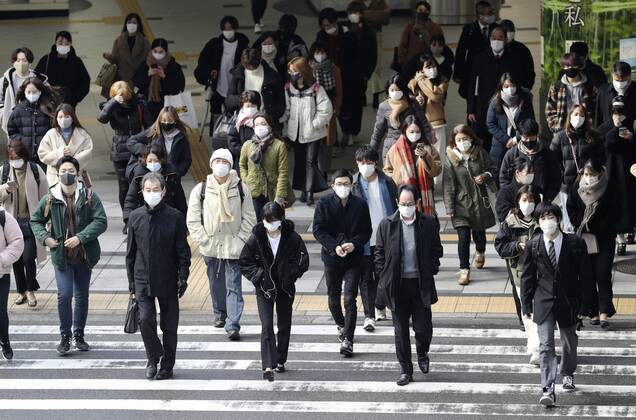 Japan to extend virus emergency to March 7 as hospitals strained People wearing face masks walk in front of JR Osaka Station on Feb. 2, 2021. The Japanese government is set to extend a coronavirus state of emergency for Tokyo, Osaka and other regions by one month to March 7 in view of manpower-strapped hospitals amid a surge in serious patients. 