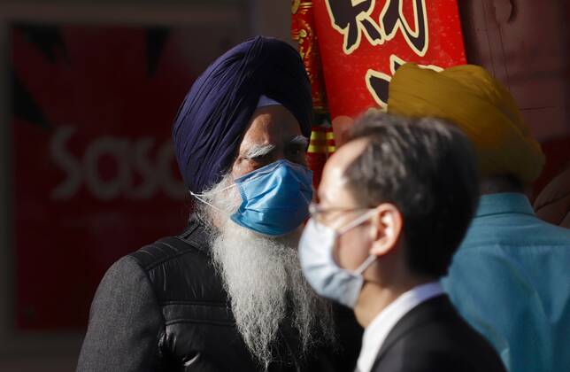 Coronavirus, Eindrücke aus Hongkong February 2, 2021, Hong Kong, CHINA: Sheikh men conversing on the street in Hong Kong.Invalidation of BNO ( Overseas ) Passports have created an impact on ethnic minorities in Hong Kong, who are largely, holders of BNO ( Overseas ) Passports. They are now a holder of invalid travel document not recognized by PRC and HKSAR government, unable to exit from HK by sea, air and land.Feb-2,2021Hong Kong.ZUMA Hong Kong CHINA - ZUMAl137 20210202_zap_l137_002 Copyright: xLiauxChung-renx