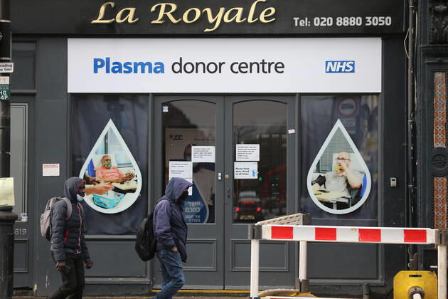 February 2, 2021, London, England, United Kingdom: People walk past a plasma donor centre In Tottenham. The north London neighbourhood is among the seven areas in the country the UK government started Ã¢â‚¬oesurge testingÃ¢â‚¬Â to find and isolate covid-19 cases caused by South African variant of the coronavirus. London United Kingdom - ZUMAs262 20210202_zip_s262_017 Copyright: xTayfunxSalcix