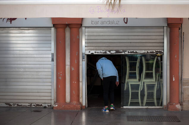 February 2, 2021, Malaga, Spain: A person entering into the partially closed La Bougadilla restaurant during the closure of the hospitality sector and non-essential activities as part of a partial lockdown..For two weeks, besides the limit on mobility between cities, many municipalities and Costa del Sol districts (including the Malaga capital) will have to close bars, restaurants and stores as measures to curb the spread of the coronavirus pandemic. In the lead of Andalusia, Malaga is the city with more daily coronavirus infections and a high rate of hospitalizations. Malaga Spain - ZUMAs197 20210202_zab_s197_008 Copyright: xJesusxMeridax