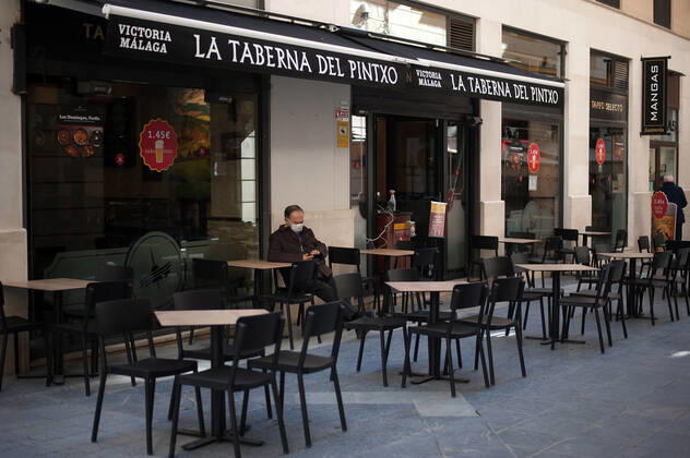 February 2, 2021, Malaga, Spain: A costumer sitting at an empty terrace outside La terraza del Pintxo bar during the closure of the hospitality sector and non-essential activities as part of a partial lockdown..For two weeks, besides the limit on mobility between cities, many municipalities and Costa del Sol districts (including the Malaga capital) will have to close bars, restaurants and stores as measures to curb the spread of the coronavirus pandemic. In the lead of Andalusia, Malaga is the city with more daily coronavirus infections and a high rate of hospitalizations. Malaga Spain - ZUMAs197 20210202_zab_s197_009 Copyright: xJesusxMeridax