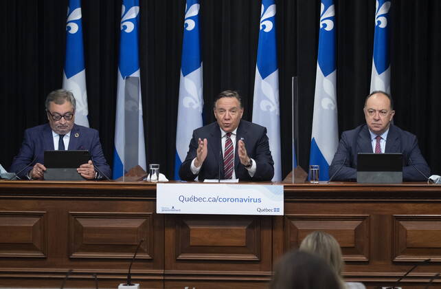 February 2, 2021, Quebec, PQ, Canada: Quebec Premier Francois Legault outlines new measures during a news conference on the COVID-19 pandemic, Tuesday, February 2, 2021 at the legislature in Quebec City. Legault is flanked by Horacio Arruda, Quebec director of National Public Health, left, and Christian Dube. Quebec Canada - ZUMAc35_ 20210202_zaf_c35_050 Copyright: xJacquesxBoissinotx