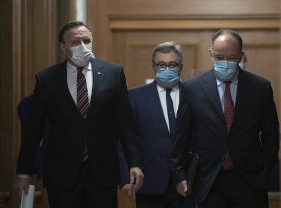 February 2, 2021, Quebec, PQ, Canada: Quebec Premier Francois Legault, from the left, Horacio Arruda, Quebec director of National Public Health and Quebec Health Minister Christian Dube walk to a news conference on the COVID-19 pandemic, Tuesday, February 2, 2021 at the legislature in Quebec City. Quebec Canada - ZUMAc35_ 20210202_zaf_c35_053 Copyright: xJacquesxBoissinotx