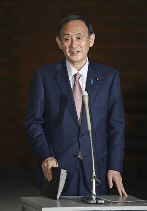 Virus-related laws revised Japanese Prime Minister Yoshihide Suga meets the press in Tokyo on Feb. 3, 2021, after parliament enacted revisions to the coronavirus special measures law and the infectious disease law. 