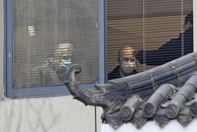 WHO investigation into coronavirus origins in Wuhan Members of the World Health Organization s team investigating the origins of the coronavirus pandemic visit a residential area in Wuhan, China, on Feb. 4, 2021. 