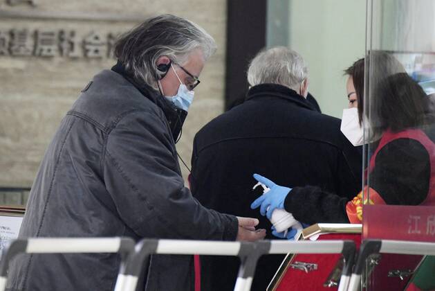 WHO investigation into coronavirus origins in Wuhan Members of the World Health Organization s team investigating the origins of the coronavirus pandemic visit a residential area in Wuhan, China, on Feb. 4, 2021. 