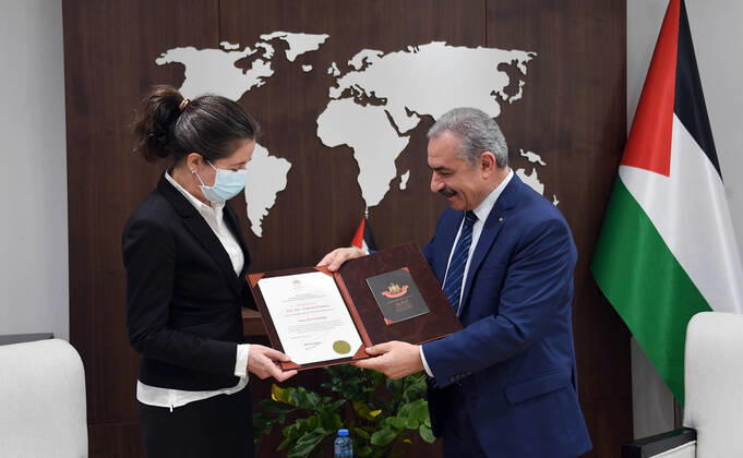 February 4, 2021, Ramallah, West Bank, Palestinian Territory: Palestinian Prime Minister Mohammad Ishtayeh, awards the representative of Denmark to the State of Palestine, Natalia Feinberg and the Order of the Star of Jerusalem, in the West Bank city of Ramallah, on February 4, 2021 Ramallah Palestinian Territory - ZUMAap3_ 20210204_zaf_ap3_171 Copyright: xPrimexMinisterxOfficex