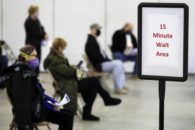 People wait their mandatory 15 minutes after receiving the Moderna coronavirus vaccine in Medina, Ohio, Thursday, February 4, 2021.  CLE20200204123 AARONxJOSEFCZYK