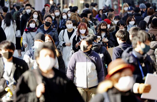 Coronavirus cases top 400,000 in Japan People wearing face masks to protect against the novel coronavirus walk in Tokyo s Shibuya area on Feb. 5, 2021. The cumulative number of coronavirus cases in Japan exceeded 400,000 the same day. 
