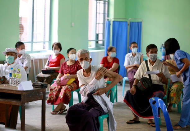 (210205) -- YANGON, Feb. 5, 2021 -- People are seen at a waiting area after receiving the COVID-19 vaccine at a school in Yangon, Myanmar, Feb. 5, 2021. Myanmar resumed the vaccination program against COVID-19 across the country on Friday, according to an announcement from the Health and Sports Ministry. (Photo by Xinhua) MYANMAR-VACCINATION-COVID-19-RESUMPTION Haymhan 