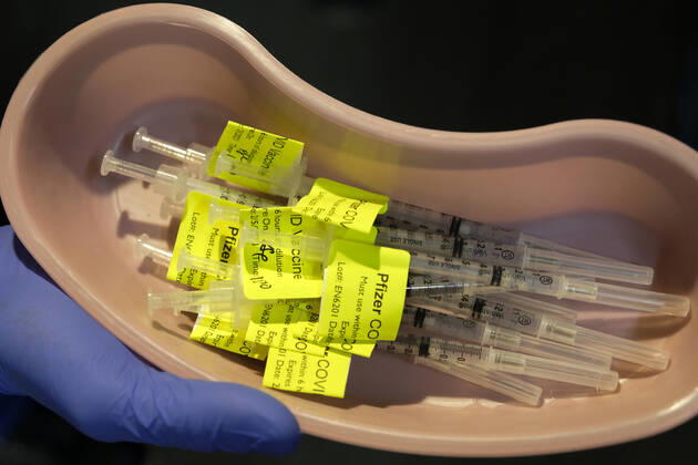 February 5, 2021, Los Angeles, California, USA: Syringes prepared with Pfizer COVID-19 vaccine are seen at a mass COVID-19 vaccination site at Cal Poly Pomona, Friday Feb. 5, 2021 in Pomona, California. Los Angeles USA - ZUMAc68_ 20210205_zaf_c68_002 Copyright: xRingoxChiux