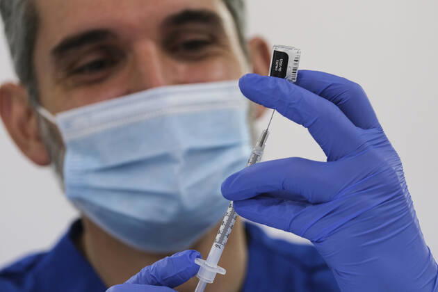 February 5, 2021, Los Angeles, California, USA: A healthcare worker prepares doses of COVID-19 vaccine at a mass COVID-19 vaccination site at Cal Poly Pomona, Friday Feb. 5, 2021 in Pomona, California. Los Angeles USA - ZUMAc68_ 20210205_zaf_c68_017 Copyright: xRingoxChiux