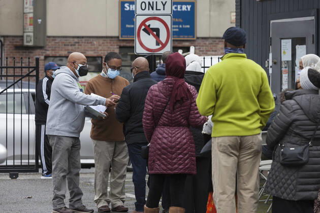 February 5, 2021, Seattle, Washington, USA: Staff members check in patients at a pop up vaccination clinic at the Ethiopian Community of Seattle in the Rainier Valley on Friday, February 5, 2021. To date, the Seattle Fire Department Mobile Vaccination Teams have vaccinated 2,436 vulnerable Seattle residents and workers since launching its vaccination effort on January 14, 2021. Seattle USA - ZUMAg235 20210205_zap_g235_011 Copyright: xPaulxChristianxGordonx