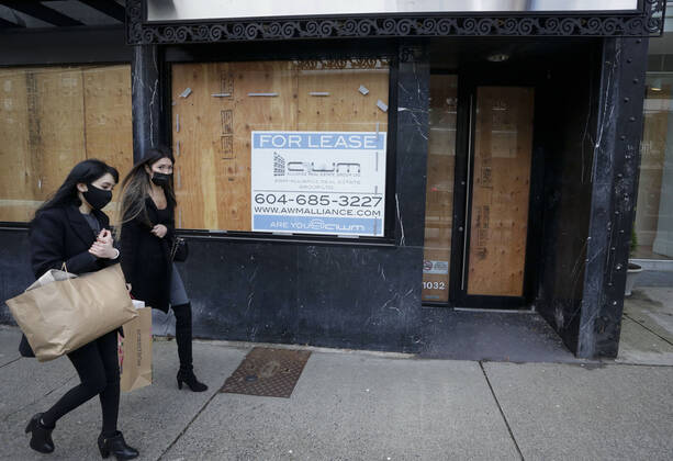 (210205) -- VANCOUVER, Feb. 5, 2021 -- People wearing face masks walk past space for lease in downtown Vancouver, British Columbia, Canada, on Feb. 5, 2021. The unemployment rate in Canada rose by 0.6 percentage point to 9.4 percent in January, the highest rate since August 2020, said official Statistics Canada on Friday. (Photo by Xinhua) CANADA-VANCOUVER-UNEMPLOYMENT RATE-RISING LiangxSen 