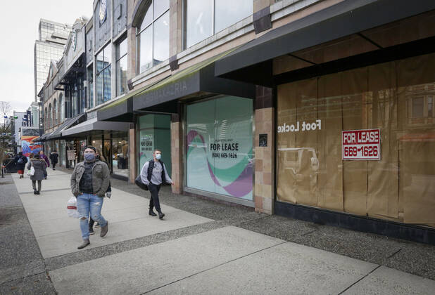 (210205) -- VANCOUVER, Feb. 5, 2021 -- People wearing face masks walk past space for lease in downtown Vancouver, British Columbia, Canada, on Feb. 5, 2021. The unemployment rate in Canada rose by 0.6 percentage point to 9.4 percent in January, the highest rate since August 2020, said official Statistics Canada on Friday. (Photo by Xinhua) CANADA-VANCOUVER-UNEMPLOYMENT RATE-RISING LiangxSen 