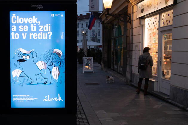 (210206) -- LJUBLJANA, Feb. 6, 2021 -- A billboard reminding people to properly dispose of used face masks is seen in Ljubljana, Slovenia, Feb. 5, 2021. More services will be available to Slovenians as the government announced on Friday relaxation of restrictive measures imposed to contain the coronavirus. Slovenia on Friday registered 959 new COVID-19 cases, taking the national tally of confirmed cases to 172,209, according to the National Institute of Public Health. ) SLOVENIA-COVID-19-CASES PengxLijun 