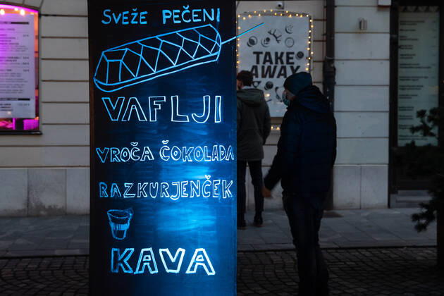 (210206) -- LJUBLJANA, Feb. 6, 2021 -- People queue to buy food and coffee in Ljubljana, Slovenia, Feb. 5, 2021. More services will be available to Slovenians as the government announced on Friday relaxation of restrictive measures imposed to contain the coronavirus. Slovenia on Friday registered 959 new COVID-19 cases, taking the national tally of confirmed cases to 172,209, according to the National Institute of Public Health. ) SLOVENIA-COVID-19-CASES PengxLijun 