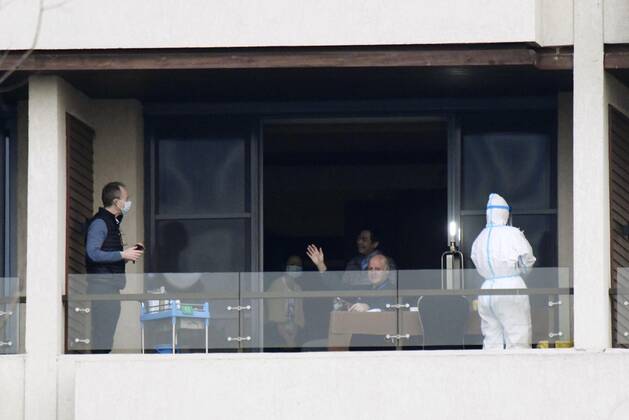 WHO investigation into coronavirus origins in Wuhan Members of the World Health Organization s team investigating the origins of the coronavirus pandemic are seen in a hotel room in Wuhan, China, on Feb. 6, 2021. 