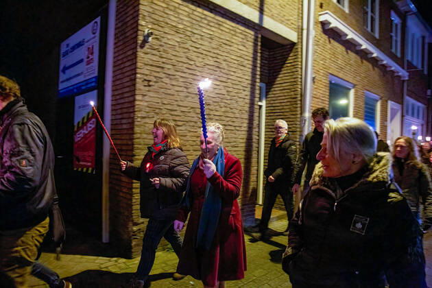 February 5, 2021, Tilburg, North Brabant, Netherlands: An elderly protester holding a torch during the demonstration..A torch-lit protest was held against the new measures that the government imposed in January to fight the spread of the Coronavirus Covid-19 pandemic. The Anti-Curfew and Anti-lockdown demonstration were peaceful. A strict curfew is applied in the Netherlands between 21:00-04:30. Violent protests against the Covid 19 measures took place in January. Tilburg Netherlands - ZUMAs197 20210205_zaa_s197_259 Copyright: xNikxOikox