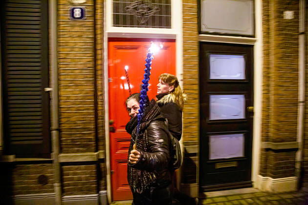 February 5, 2021, Tilburg, North Brabant, Netherlands: A protester holding a torch during the demonstration..A torch-lit protest was held against the new measures that the government imposed in January to fight the spread of the Coronavirus Covid-19 pandemic. The Anti-Curfew and Anti-lockdown demonstration were peaceful. A strict curfew is applied in the Netherlands between 21:00-04:30. Violent protests against the Covid 19 measures took place in January. Tilburg Netherlands - ZUMAs197 20210205_zaa_s197_262 Copyright: xNikxOikox