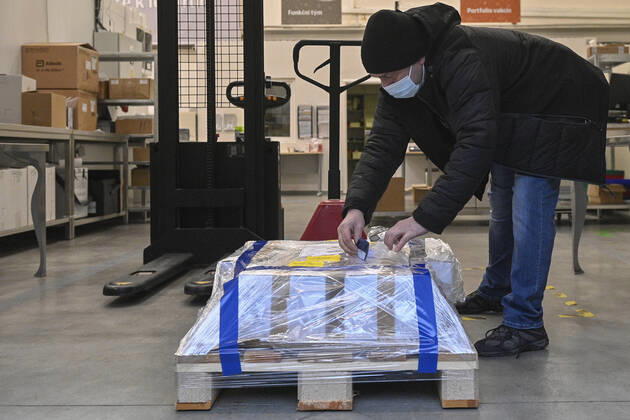 The first delivery of the vaccine against coronavirus from the AstraZeneca firm arrived in the dispatching centre of the Avenier company in Ricany near Prague, Czech Republic, on Saturday morning, February 6, 2021. (CTKxPhoto MichalxKamaryt) CTKPhotoP202102060168601  kmt 4