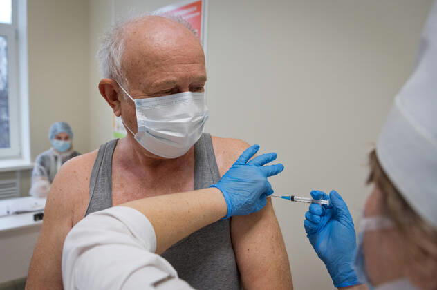 SEVASTOPOL, RUSSIA - FEBRUARY 8, 2021: A patient and a medical worker during vaccination with the Gam-COVID-Vak (Sputnik V) vaccine against COVID-19 at Dasha Sevastopolskaya Hospital No 5. Sergei Malgavko TASS  TS0F642E