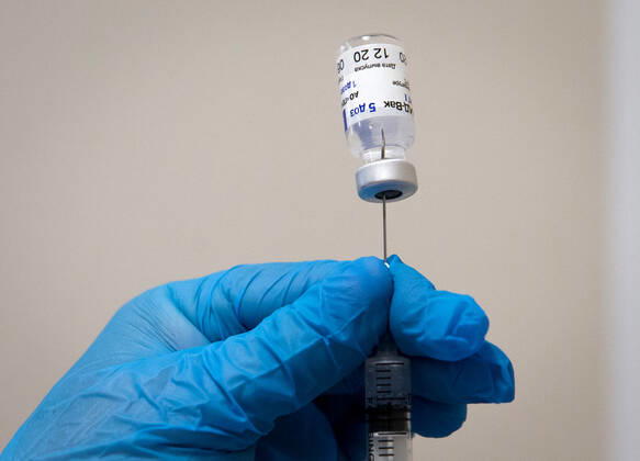 SEVASTOPOL, RUSSIA - FEBRUARY 8, 2021: A medical worker prepares a syringe with the Gam-COVID-Vak (Sputnik V) vaccine against COVID-19 at Dasha Sevastopolskaya Hospital No 5. Starting February 8, Sevastopol starts a mass COVID-19 vaccination campaign; earlier, the vaccine was available to medical workers and teachers only. Sergei Malgavko TASS  TS0F6432