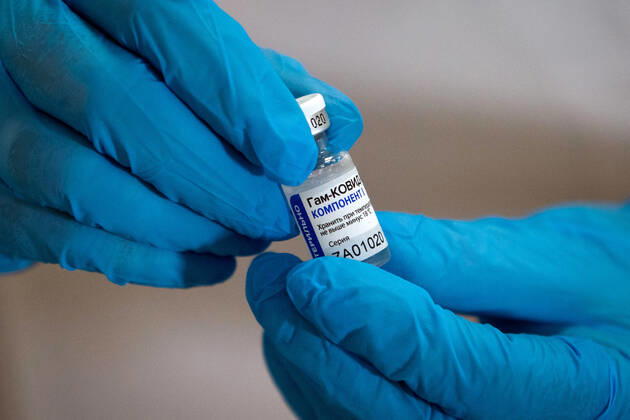 SEVASTOPOL, RUSSIA - FEBRUARY 8, 2021: A medical worker holds an ampoule with the Gam-COVID-Vak (Sputnik V) vaccine against COVID-19 at Dasha Sevastopolskaya Hospital No 5. Starting February 8, Sevastopol starts a mass COVID-19 vaccination campaign; earlier, the vaccine was available to medical workers and teachers only. Sergei Malgavko TASS  TS0F6436