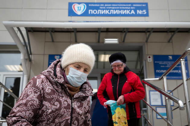 SEVASTOPOL, RUSSIA - FEBRUARY 8, 2021: People walk out of Dasha Sevastopolskaya Hospital No 5. Starting February 8, Sevastopol starts a mass COVID-19 vaccination campaign; earlier, the vaccine was available to medical workers and teachers only. Sergei Malgavko TASS  TS0F6439