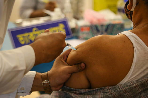 Bangladesh: Covid-19 vaccination drive begins in Dhaka A man getting a shot with the dose of Covishield covid-19 vaccine during the vaccination drive. Dhaka Dhaka Division Bangladesh Copyright: NahidxHasan