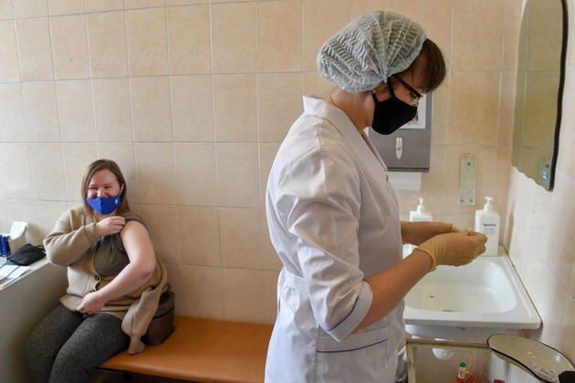 VLADIVOSTOK, RUSSIA - FEBRUARY 9, 2021: A woman receives an injection of component 2 of the Gam-COVID-Vac (Sputnik V) vaccine against COVID-19 in one of the city s outpatient clinics. Yuri Smityuk TASS  TS0F64A1