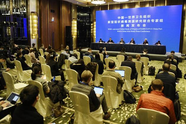 WHO investigation into coronavirus origins in Wuhan World Health Organization and Chinese experts attend a press conference in Wuhan, China, on Feb. 9, 2021. 