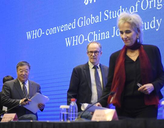 WHO investigation into coronavirus origins in Wuhan Members of the World Health Organization s team investigating the origins of the coronavirus pandemic attend a press conference in Wuhan, China, on Feb. 9, 2021, a day ahead of their departure. 