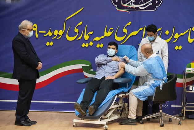 Iran: First vaccinations for Medical Staff Parsa Namaki (22) the son of Iranian Health Minister Saeed Namaki gets the first Sputnik V Covid-19 vaccine as the first Iranian who gets the vaccine injection First COVID-19 vaccinations for Iranian medical Staff were injected with Russian s Sputnik V vaccine at the Imam Khomeini Hospital Complex in Tehran, Iran on 9 Feb 2021. Tehran Tehran Iran Copyright: SobhanxFarajvan