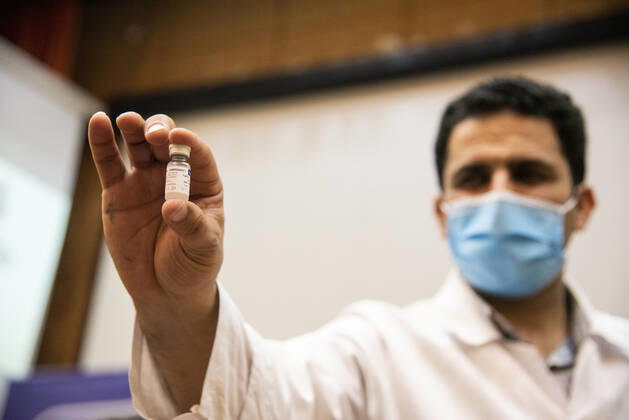 Iran: First vaccinations for Medical Staff An Iranian medical Staff shows the Sputnik V Covid-19 vaccine to media. First COVID-19 vaccinations for Iranian medical Staff were injected with Russian s Sputnik V vaccine at the Imam Khomeini Hospital Complex in Tehran, Iran on 9 Feb 2021. Tehran Tehran Iran Copyright: SobhanxFarajvan