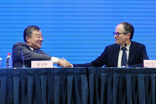 WHO investigation into coronavirus origins in Wuhan World Health Organization (R) and Chinese experts shake hands after a press conference in Wuhan, China, on Feb. 9, 2021. 