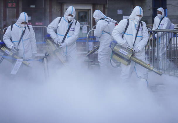 (210209) -- TONGHUA, Feb. 9, 2021 -- Staff members disinfect the square in front of the railway station of Tonghua City, northeast China s Jilin Province, Feb. 9, 2021. ) CHINA-JILIN-TONGHUA-COVID-19-DISINFECTION (CN) XuxChang 