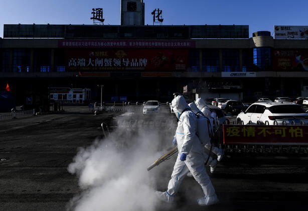 (210209) -- TONGHUA, Feb. 9, 2021 -- Staff members disinfect the square in front of the railway station of Tonghua City, northeast China s Jilin Province, Feb. 9, 2021. ) CHINA-JILIN-TONGHUA-COVID-19-DISINFECTION (CN) XuxChang 