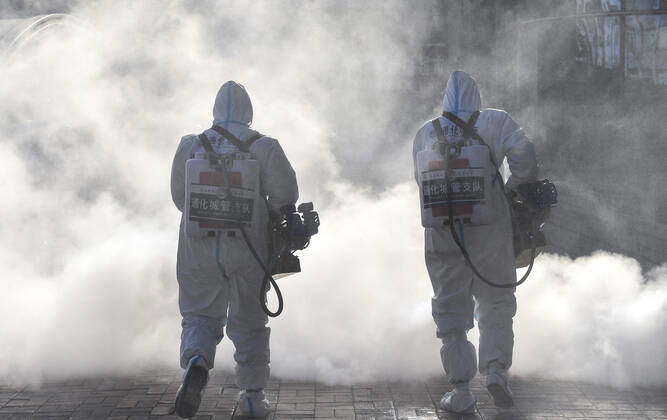 (210209) -- TONGHUA, Feb. 9, 2021 -- Staff members disinfect the square in front of the railway station of Tonghua City, northeast China s Jilin Province, Feb. 9, 2021. ) CHINA-JILIN-TONGHUA-COVID-19-DISINFECTION (CN) XuxChang 