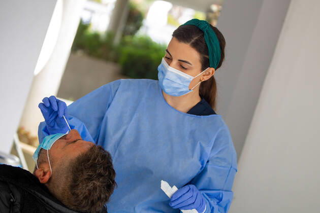 February 9, 2021, Nicosia, Cyprus: A medical worker wearing a personal protective equipment suit ( PPE) takes a swab sample at a Covid-19 testing center..The government of Cyprus is now providing free Covid-19 testing for all of it s residence. Nicosia Cyprus - ZUMAs197 20210209_zaa_s197_064 Copyright: xGeorgexChristophoroux