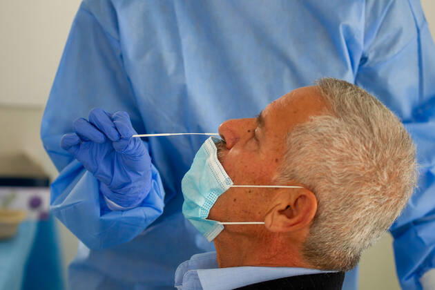 February 9, 2021, Nicosia, Cyprus: A medical worker wearing a personal protective equipment suit ( PPE) takes a swab sample at a Covid-19 testing center..The government of Cyprus is now providing free Covid-19 testing for all of it s residence. Nicosia Cyprus - ZUMAs197 20210209_zaa_s197_065 Copyright: xGeorgexChristophoroux