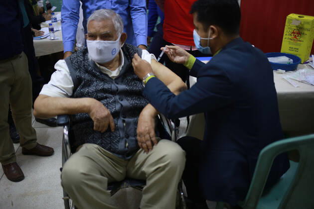 February 9, 2021: A elderly man is taking the Oxford-AstraZeneca s COVID-19 vaccine produced by the Serum Institute of India on the third day of the first phase of vaccination in Dhaka, bangladesh. - ZUMAh355 20210209_zip_h355_008 Copyright: xMd.xRakibulxHasanx