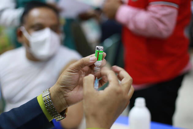 February 9, 2021: A man is taking the Oxford-AstraZeneca s COVID-19 vaccine produced by the Serum Institute of India on the third day of the first phase of vaccination in Dhaka, bangladesh. - ZUMAh355 20210209_zip_h355_009 Copyright: xMd.xRakibulxHasanx