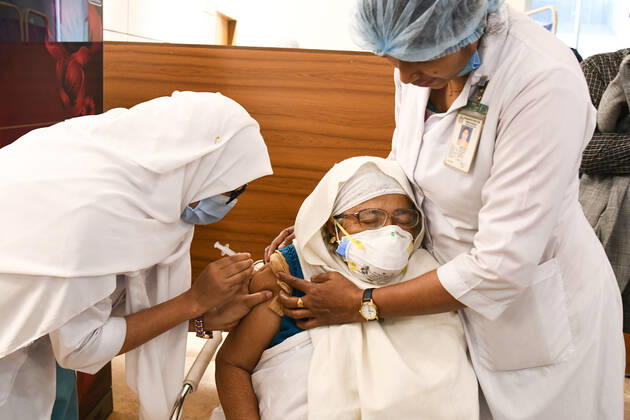 February 9, 2021, Dhaka, Bangladesh: A 77 year old woman receives the dose of Covishield covid-19 vaccine during the vaccination drive at Bangabandhu Sheikh Mujib Medical University Hospital (BSMMU)..The nationwide inoculation drive against the coronavirus has begun with hopes of spurring a quick recovery from the COVID-19 pandemic. As many as 1,015 hospitals and health centres across Bangladesh will administer the vaccine. Dhaka Bangladesh - ZUMAs197 20210209_zaa_s197_118 Copyright: xPiyasxBiswasx
