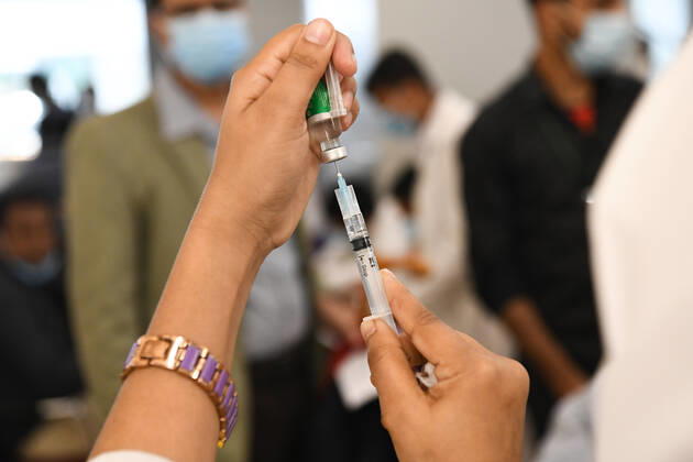 February 9, 2021, Dhaka, Bangladesh: A medical nurse preparing a syringe and an ampule with the dose of Covishield covid-19 vaccine during the vaccination drive at Bangabandhu Sheikh Mujib Medical University Hospital (BSMMU)..The nationwide inoculation drive against the coronavirus has begun with hopes of spurring a quick recovery from the COVID-19 pandemic. As many as 1,015 hospitals and health centres across Bangladesh will administer the vaccine. Dhaka Bangladesh - ZUMAs197 20210209_zaa_s197_121 Copyright: xPiyasxBiswasx